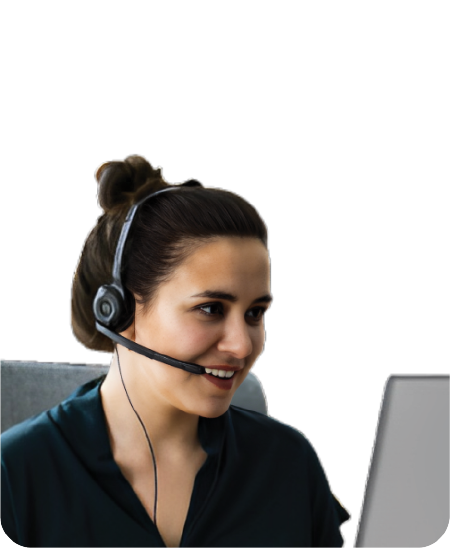 woman with a black blouse taking on a headset looking at computer